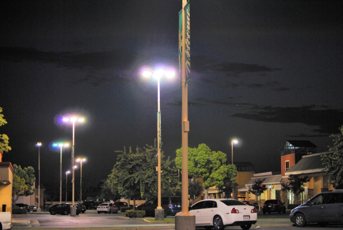 Tall parking lot lights at night