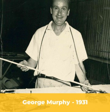 George Murphy lettering a sign in 1931